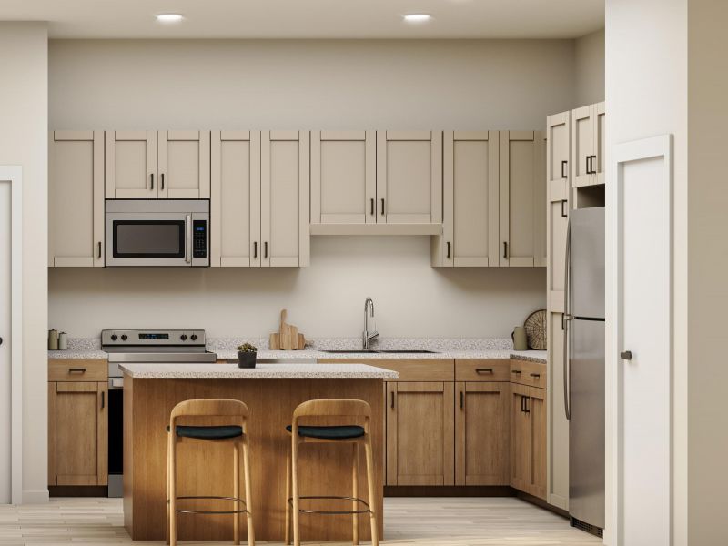 Modern kitchen with light wood cabinets, an island with two stools, stainless steel appliances, and overhead lights.